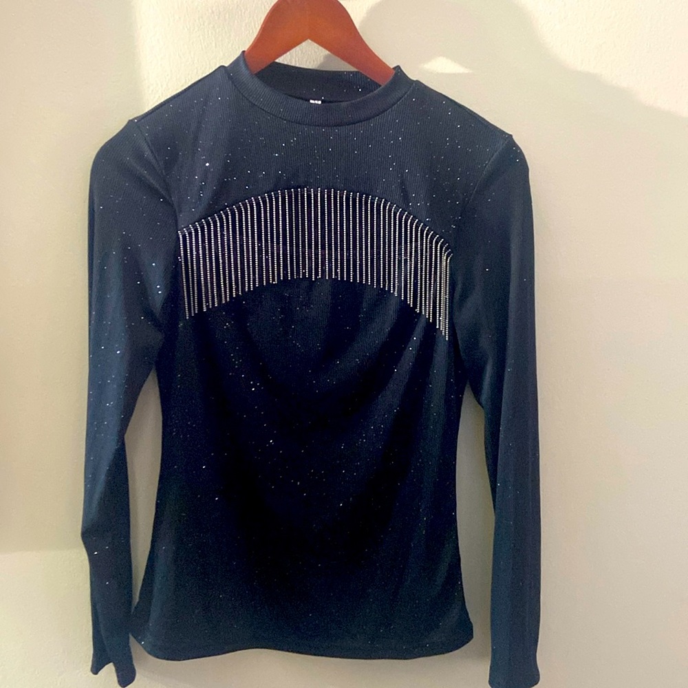 Black long sleeve ladies top size M great condition. Cut out in the front.